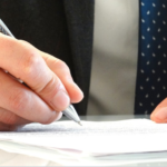 attorney slgning a document