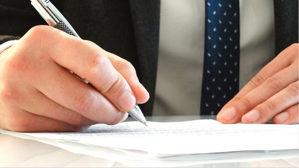 attorney slgning a document